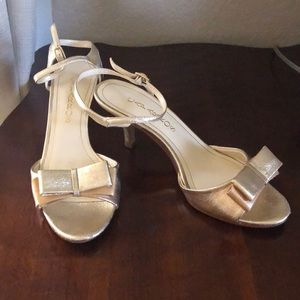 2/$10.  Caparros gold bow heels